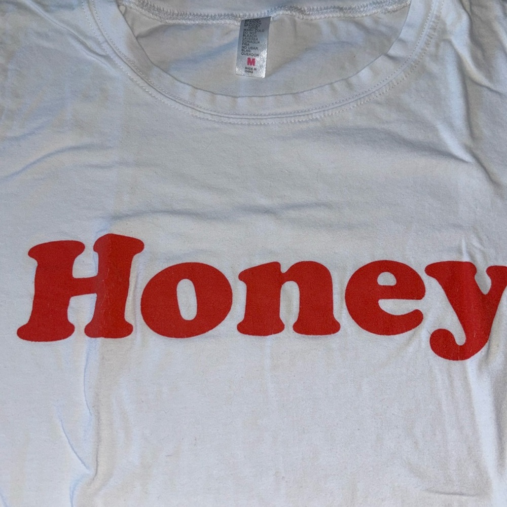white slim tee, graphic, “honey” on chest